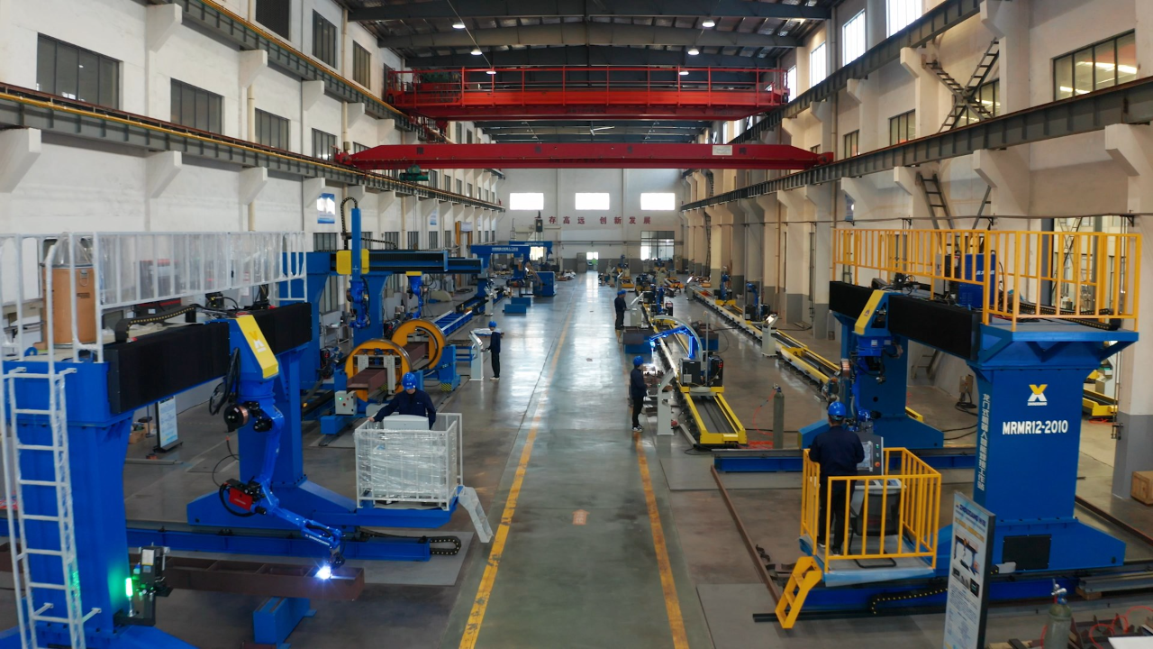 Cantilever welding robot workstation with ground rail in fabrication workshop